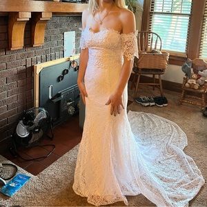 Lace wedding gown or formal gown. Mermaid style fit with long train.